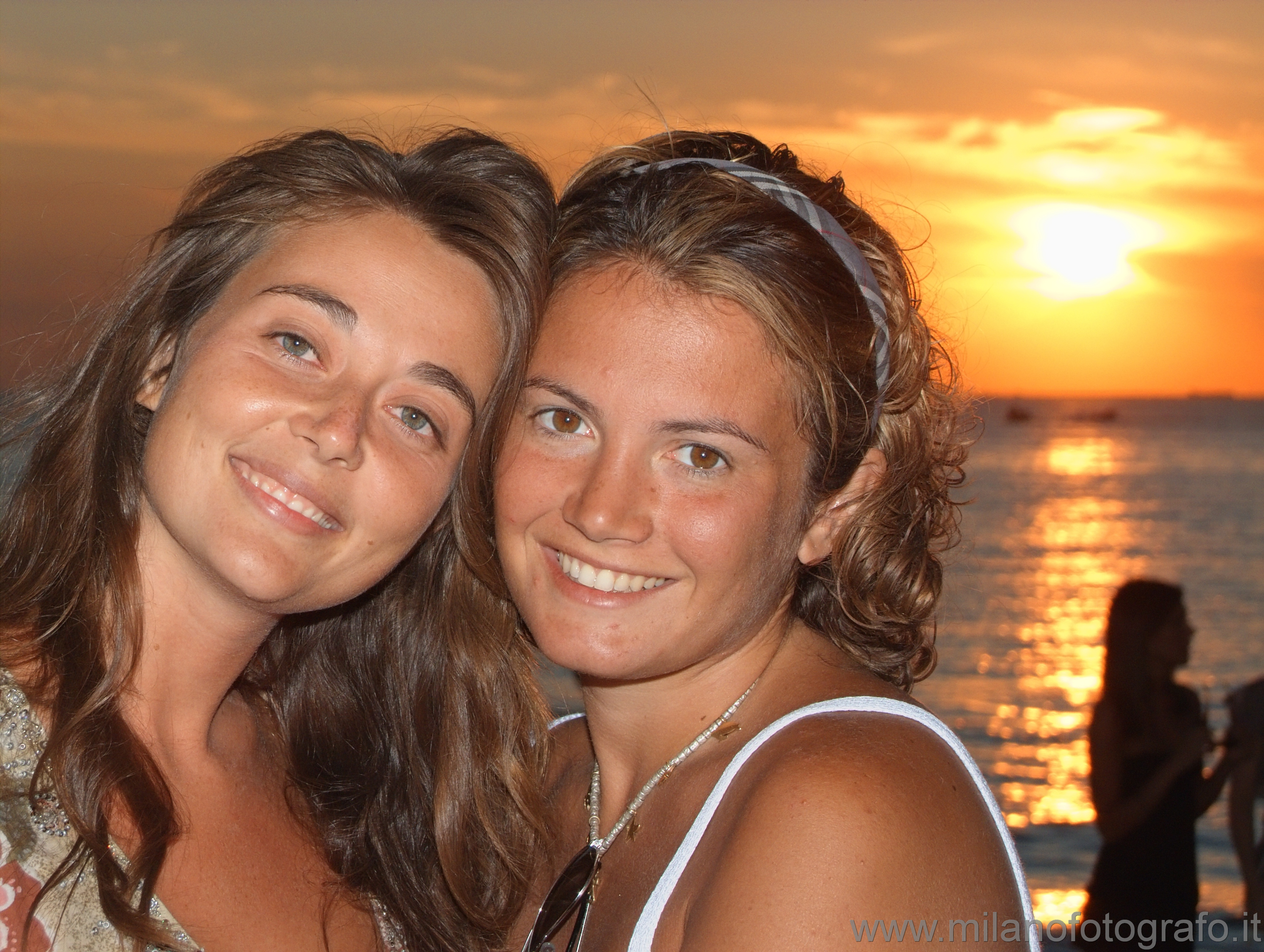 Gallipoli (Lecce, Italy) - Double female portrait with sun set as background