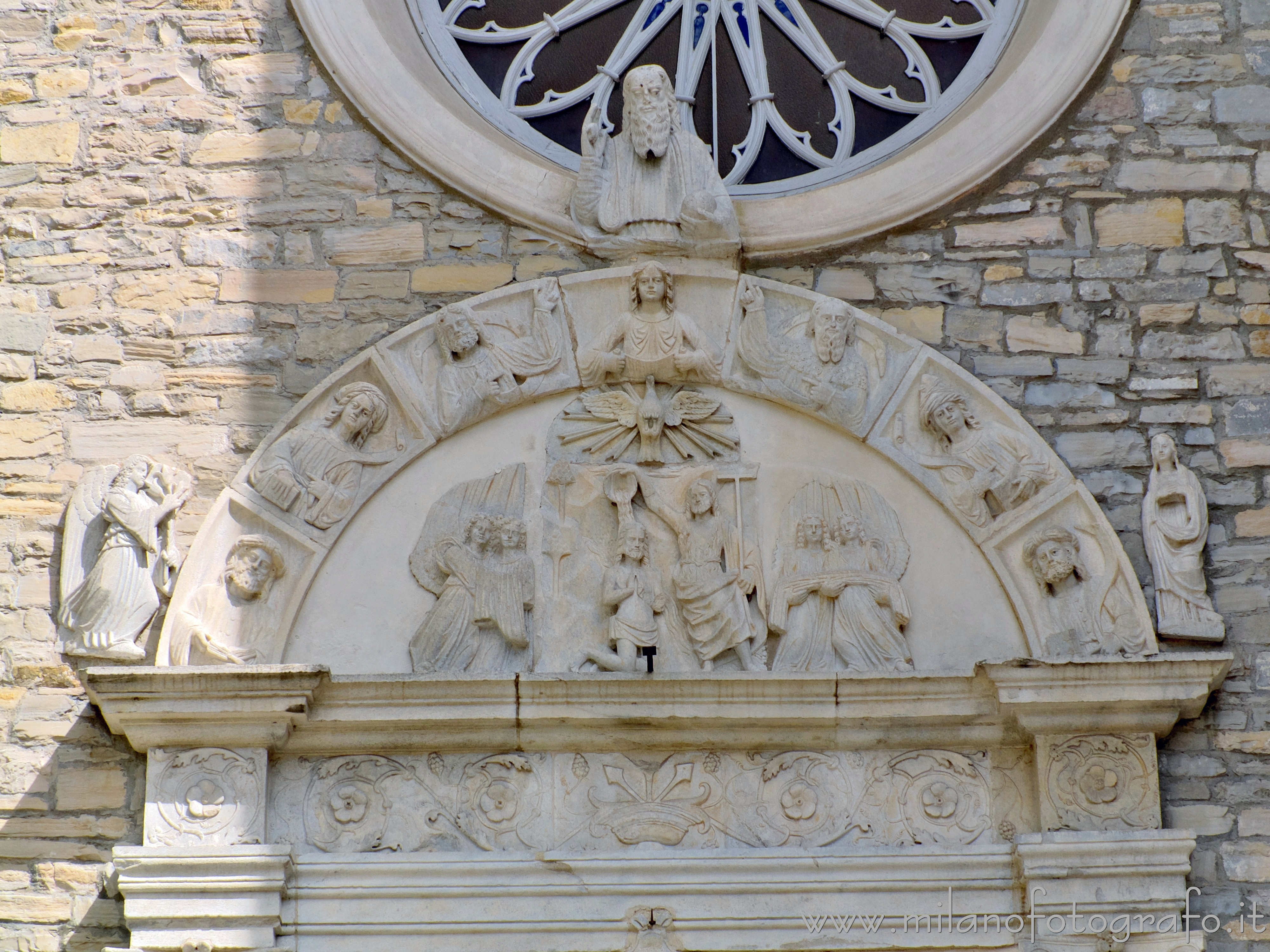 Torno (Como, Italy): Lunette of the portal of the Church of Saint John the Baptist - Torno (Como, Italy)